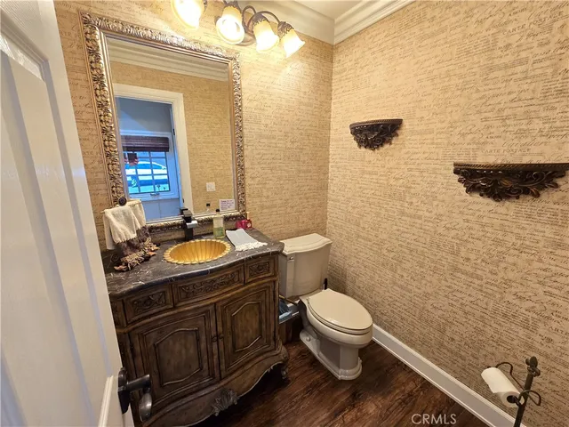 a view of a patio with a table and chairs under an umbrella with wooden floor