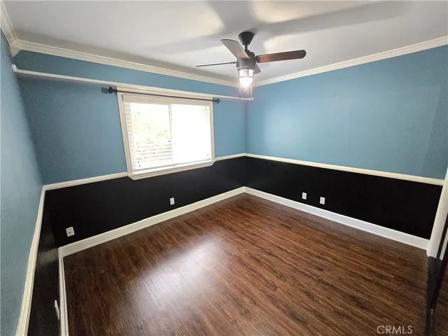 a white toilet sitting next to a bath tub