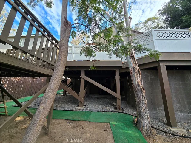 a view of a backyard patio with barbeque grill and floor