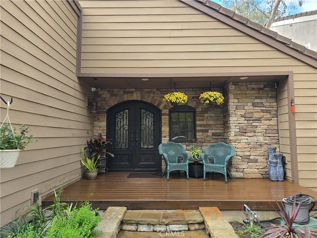 a view of entryway with wooden floor and stairs