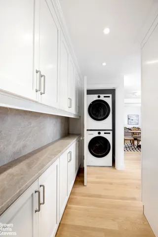 a hallway with washer and dryer