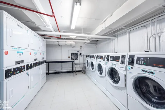 a view of a storage & utility room with washer and dryer