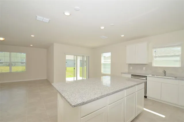 a kitchen with stainless steel appliances a refrigerator stove microwave and sink