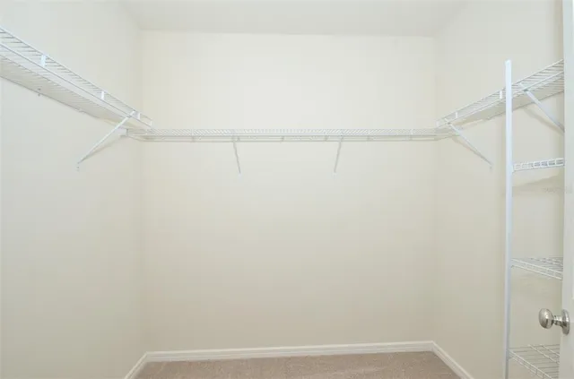 a front view of a house with a garden and yard