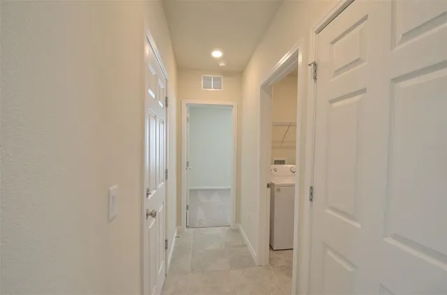a bathroom with a shower and a glass door