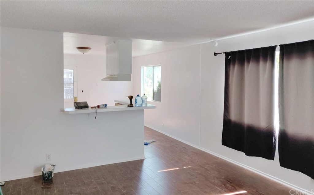 7793 15th Street Westminster, CA 92683 - Photo 3 of 11 a view of kitchen with wooden floor and electronic appliances