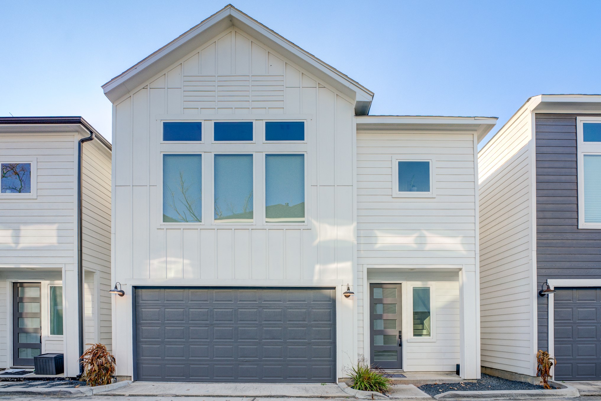 a front view of a house with garage