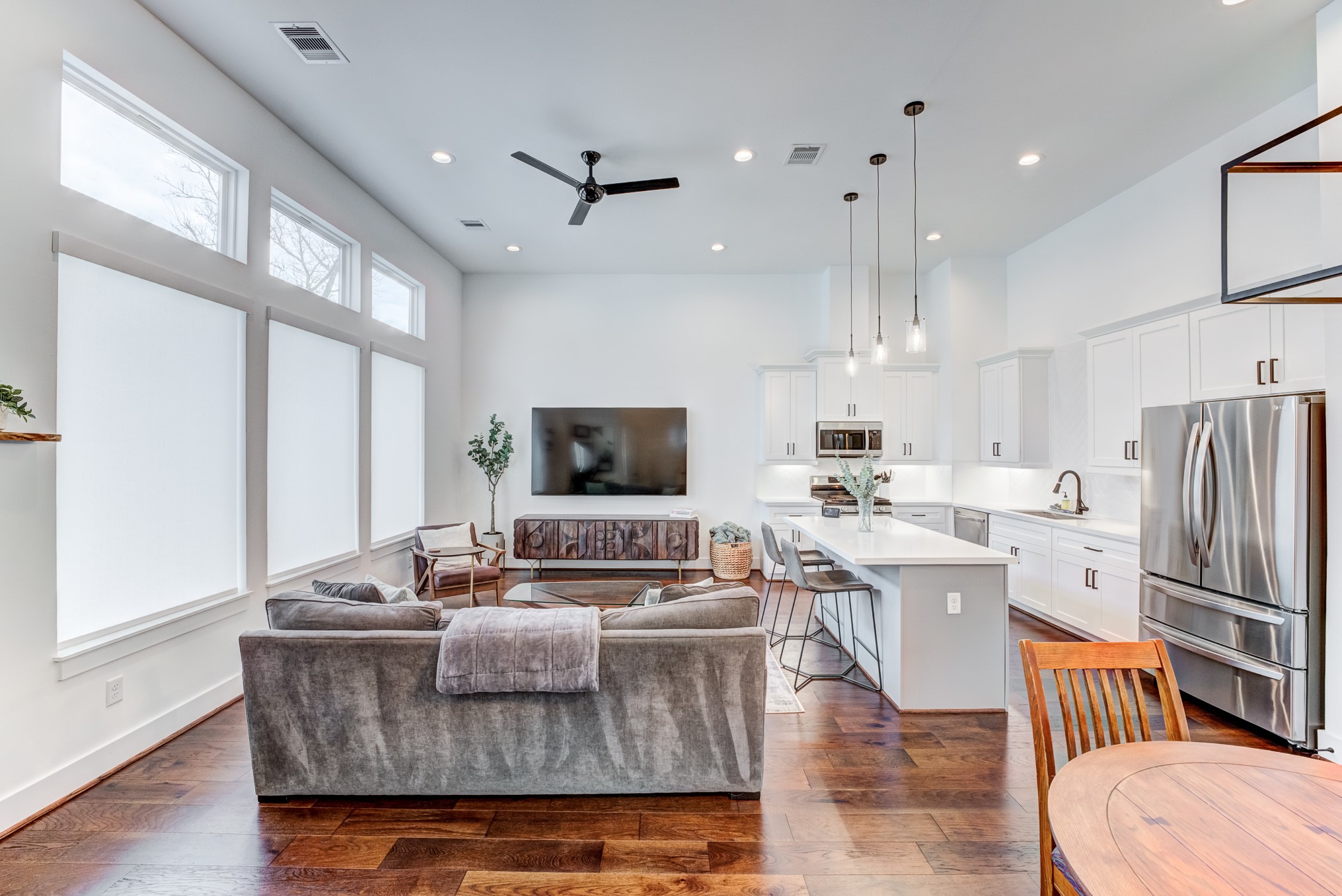 107 West Whitney Street, Unit E Houston, TX 77018 - Photo 11 of 48 a living room with stainless steel appliances granite countertop furniture a fireplace a flat screen tv and a window
