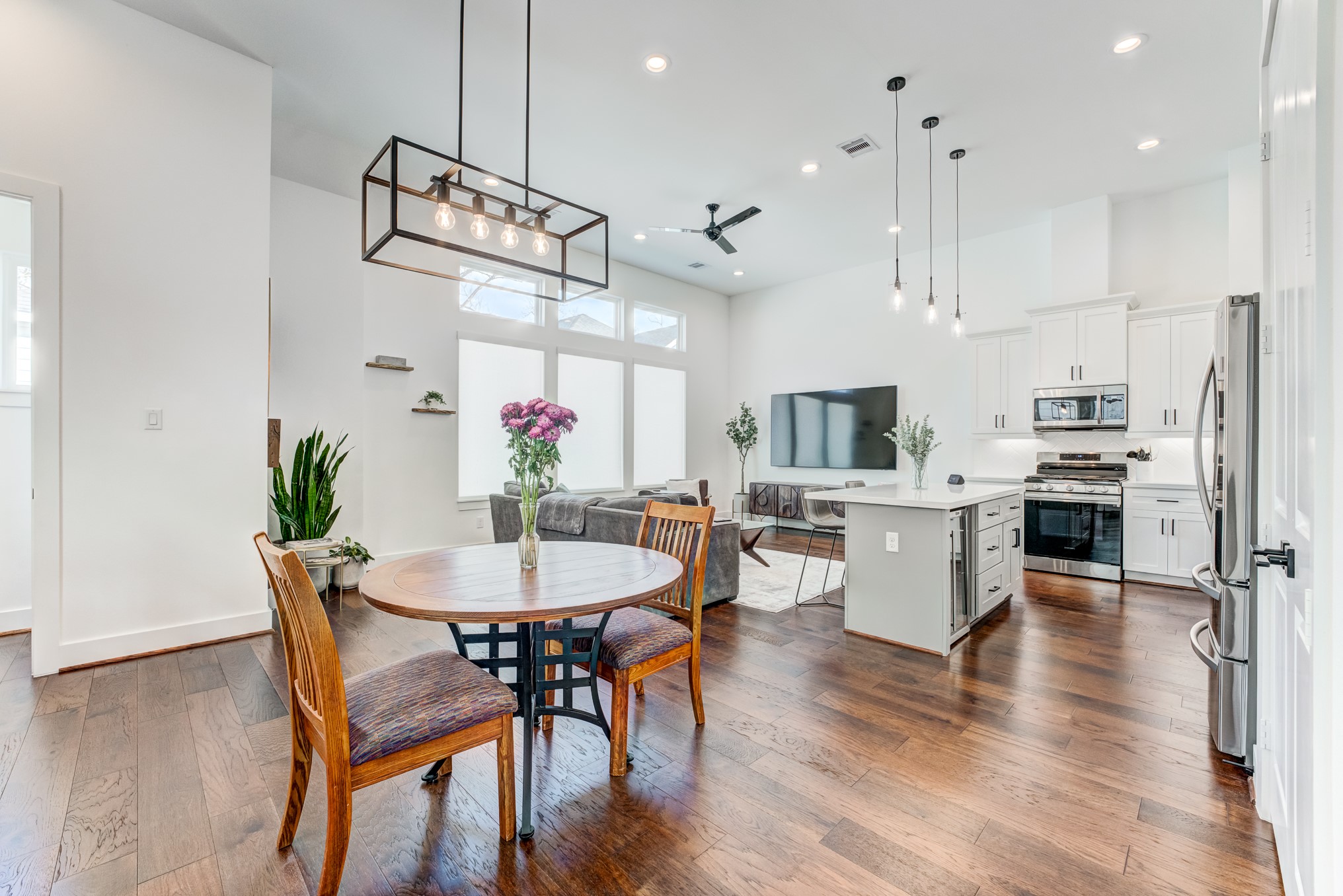 107 West Whitney Street, Unit E Houston, TX 77018 - Photo 17 of 48 a view of a dining room with furniture and wooden floor