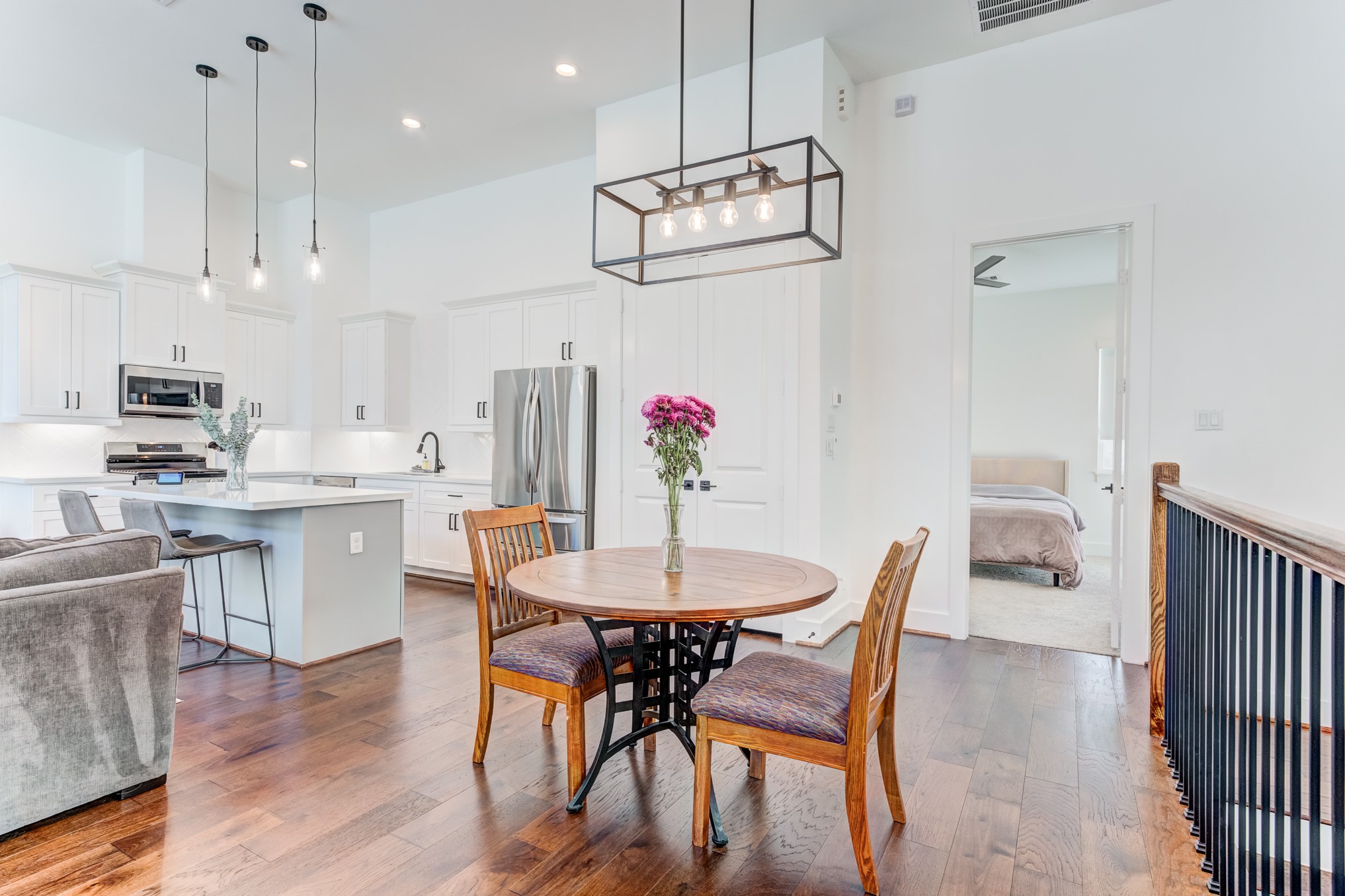 107 West Whitney Street, Unit E Houston, TX 77018 - Photo 18 of 48 a view of a dining room with furniture and wooden floor