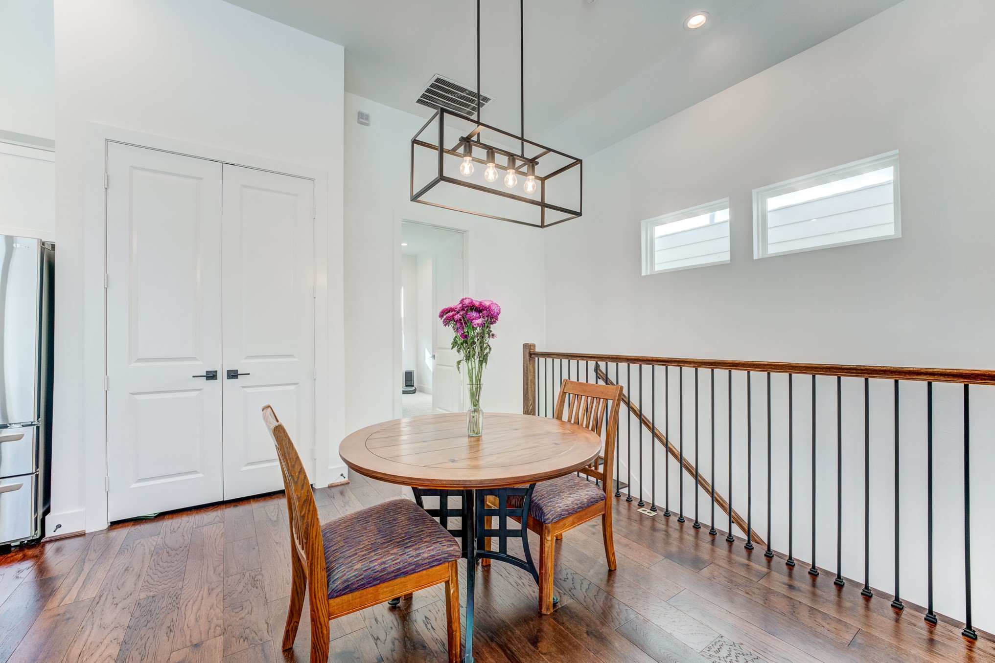 107 West Whitney Street, Unit E Houston, TX 77018 - Photo 20 of 48 a view of a dining room with furniture and wooden floor