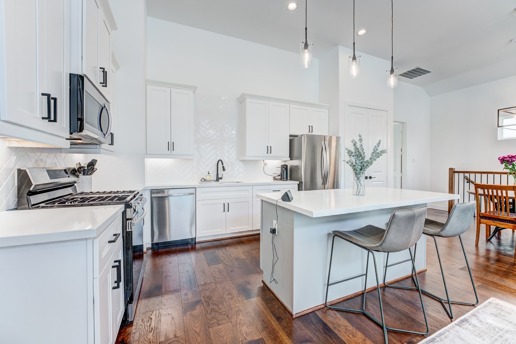107 West Whitney Street, Unit E Houston, TX 77018 - Photo 22 of 48 a kitchen with a sink a counter space appliances and cabinets