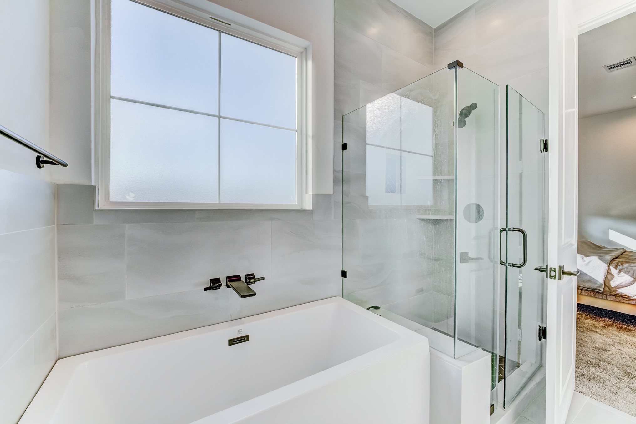 107 West Whitney Street, Unit E Houston, TX 77018 - Photo 36 of 48 a bathroom with a tub shower vanity and a sink