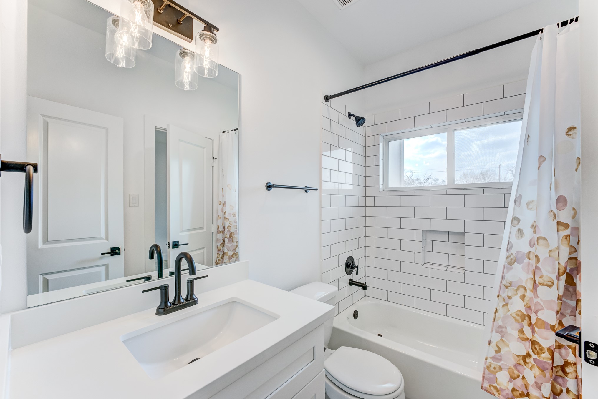 107 West Whitney Street, Unit E Houston, TX 77018 - Photo 42 of 48 a bathroom with a sink toilet and shower