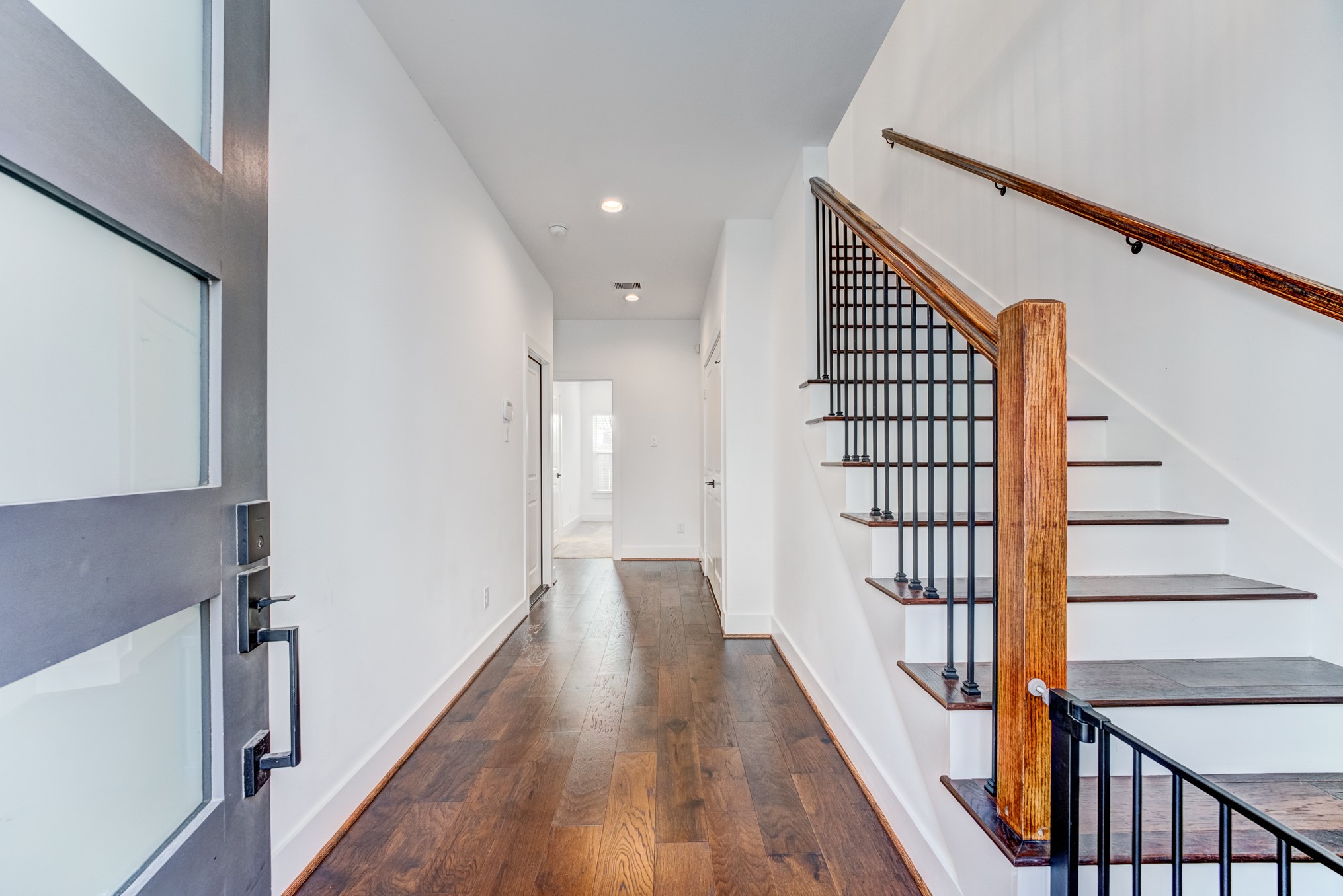 107 West Whitney Street, Unit E Houston, TX 77018 - Photo 7 of 48 a view of entryway with wooden floor