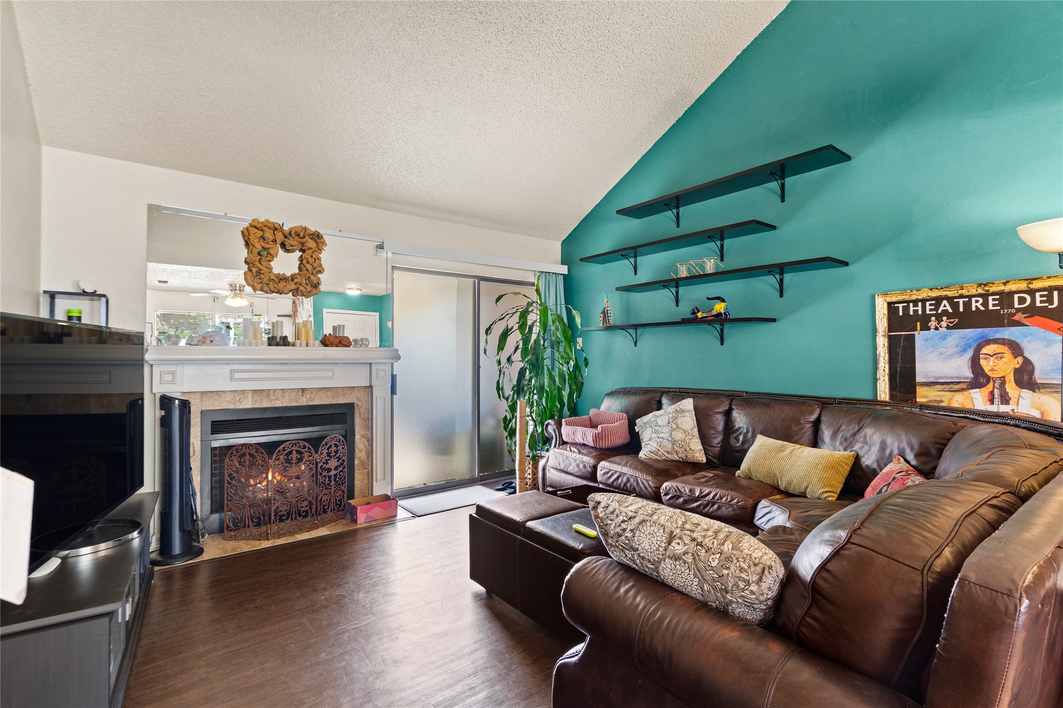 2018 West Rundberg Lane, Unit 4B Austin, TX 78758 - Photo 2 of 28 a living room with furniture and a fireplace