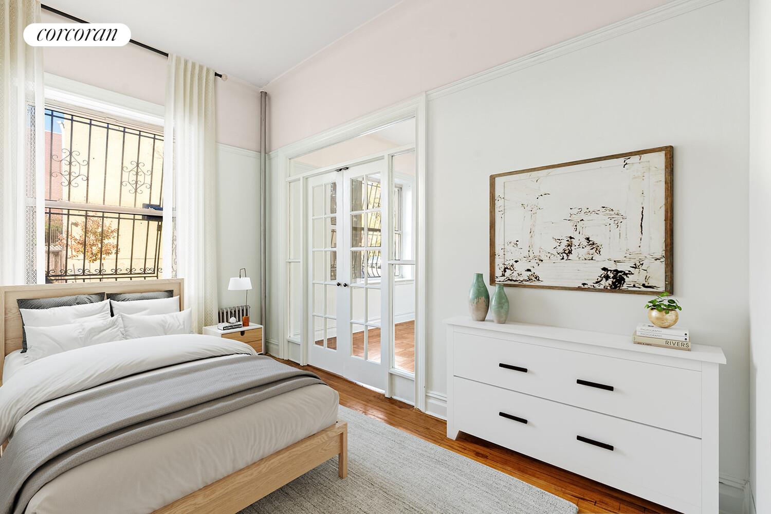 175 Prospect Park Southwest, Unit 1A Brooklyn, NY 11218 - Photo 2 of 9 a spacious bedroom with a bed and a window