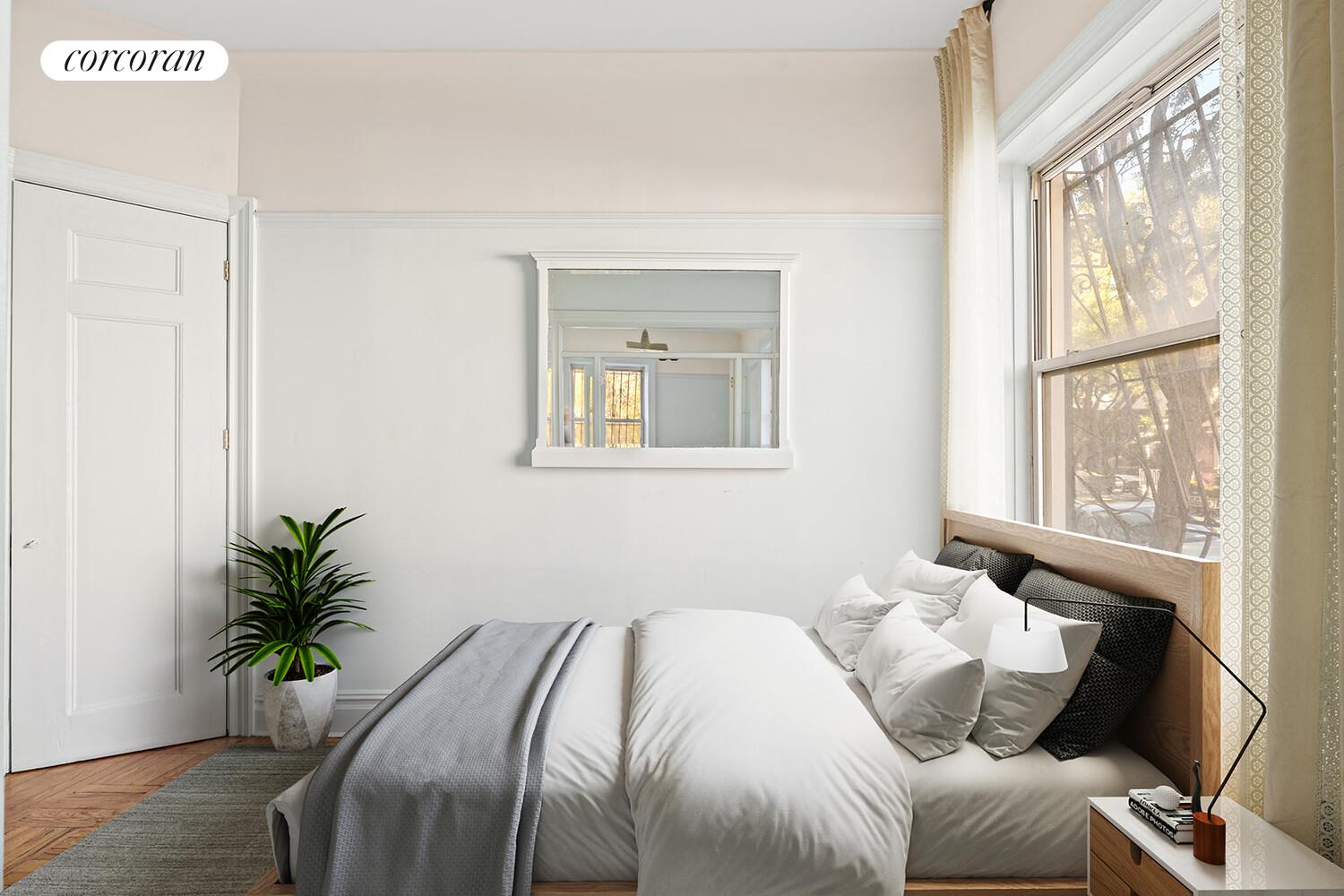 175 Prospect Park Southwest, Unit 1A Brooklyn, NY 11218 - Photo 3 of 9 a bedroom with a bed and a window