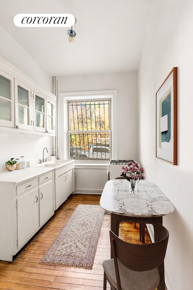 175 Prospect Park Southwest, Unit 1A Brooklyn, NY 11218 - Photo 4 of 9 a kitchen that has a sink and a stove