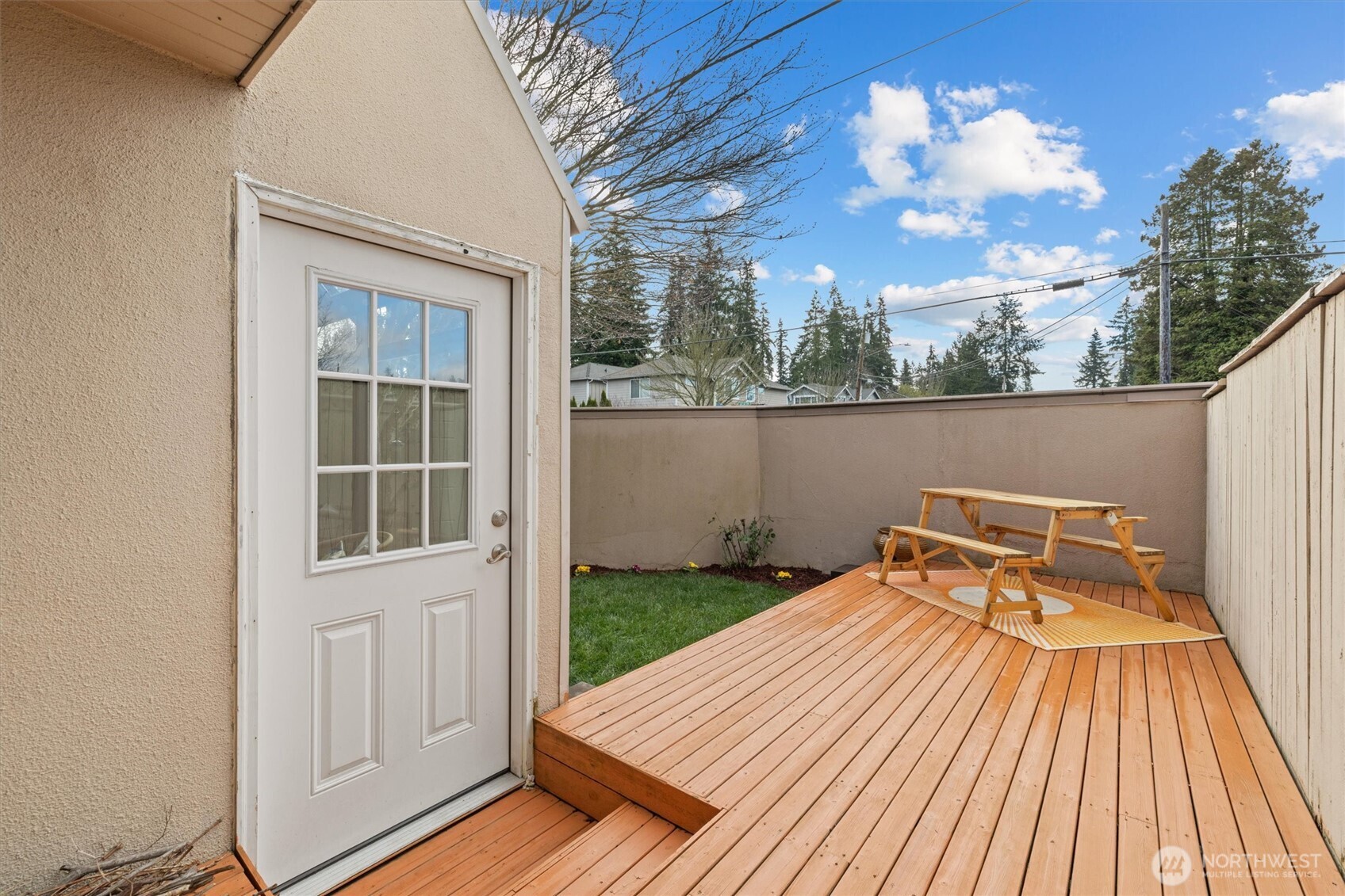 8225 212th Street Southwest, Unit 304 Edmonds, WA 98026 - Photo 16 of 35 a view of balcony with wooden floor and a potted plant