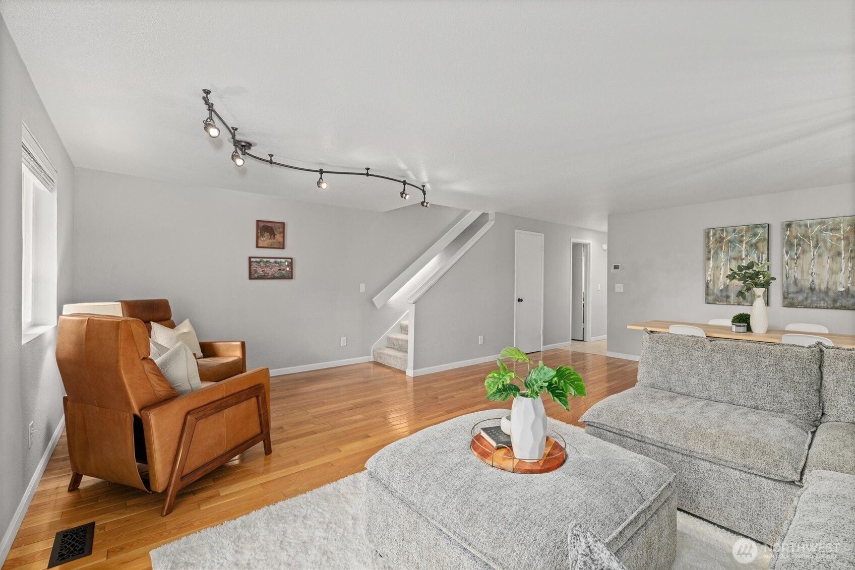 8225 212th Street Southwest, Unit 304 Edmonds, WA 98026 - Photo 18 of 35 a living room with furniture and wooden floor