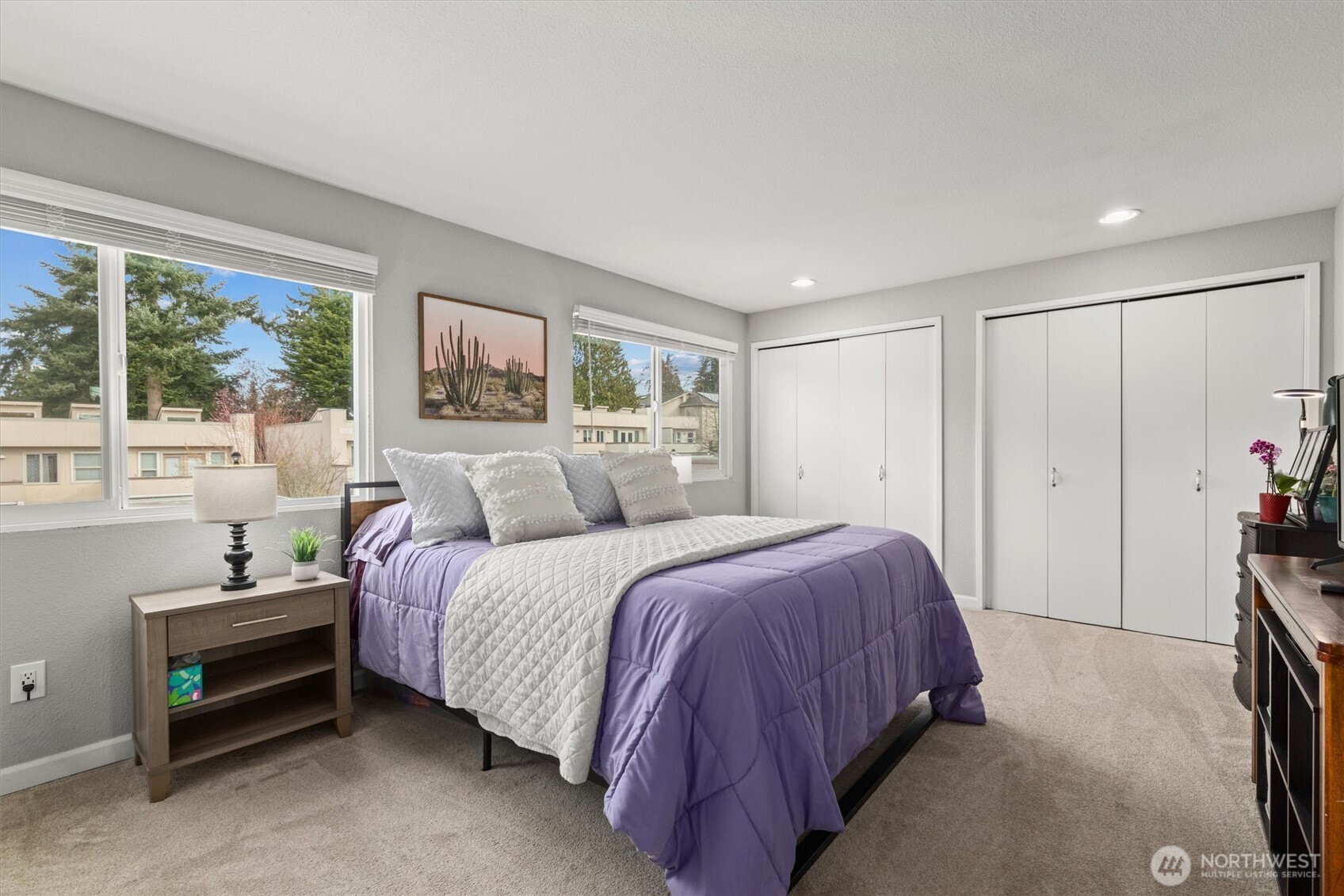 8225 212th Street Southwest, Unit 304 Edmonds, WA 98026 - Photo 21 of 35 a spacious bedroom with a bed and a window