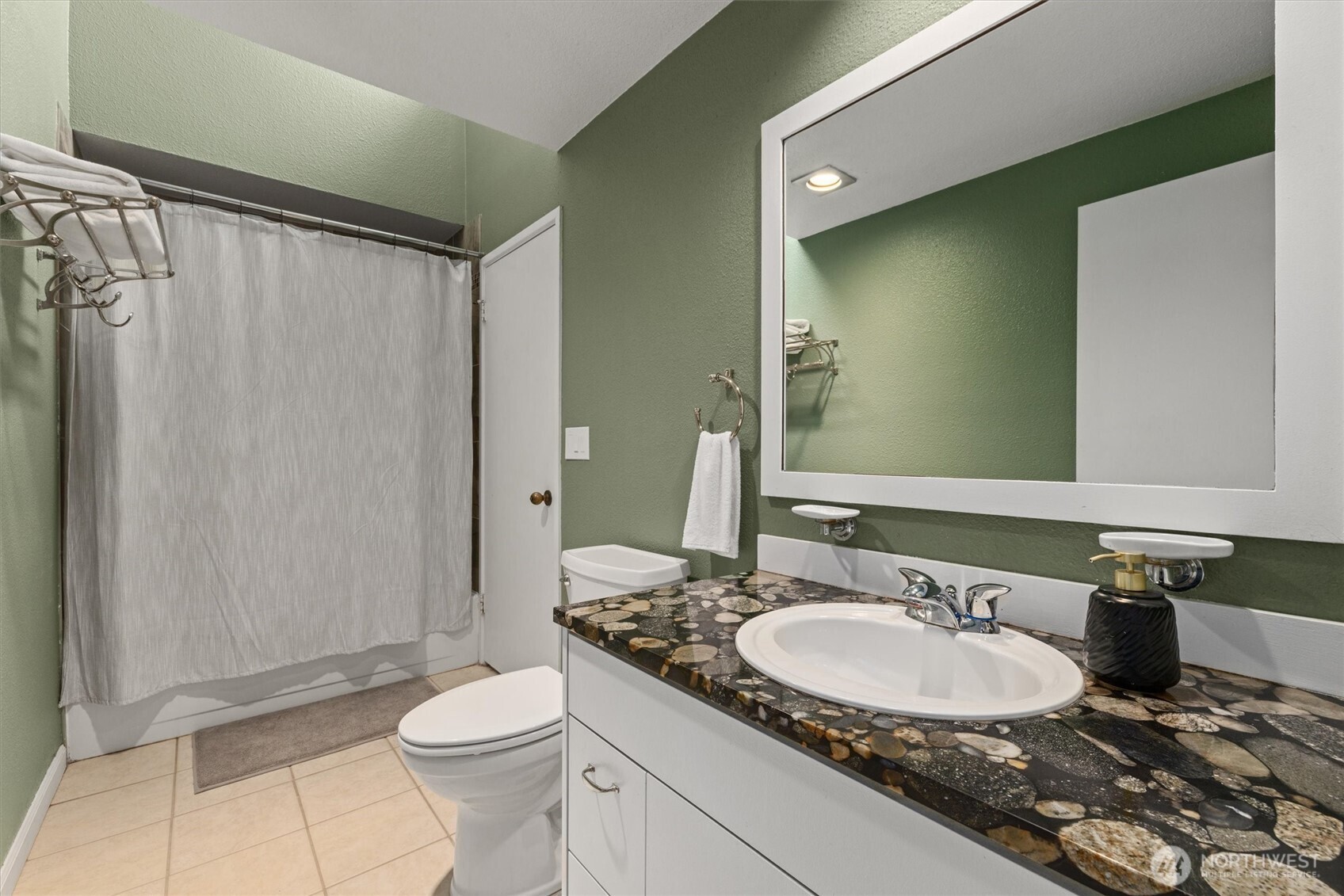 8225 212th Street Southwest, Unit 304 Edmonds, WA 98026 - Photo 23 of 35 a bathroom with a granite countertop sink toilet and shower