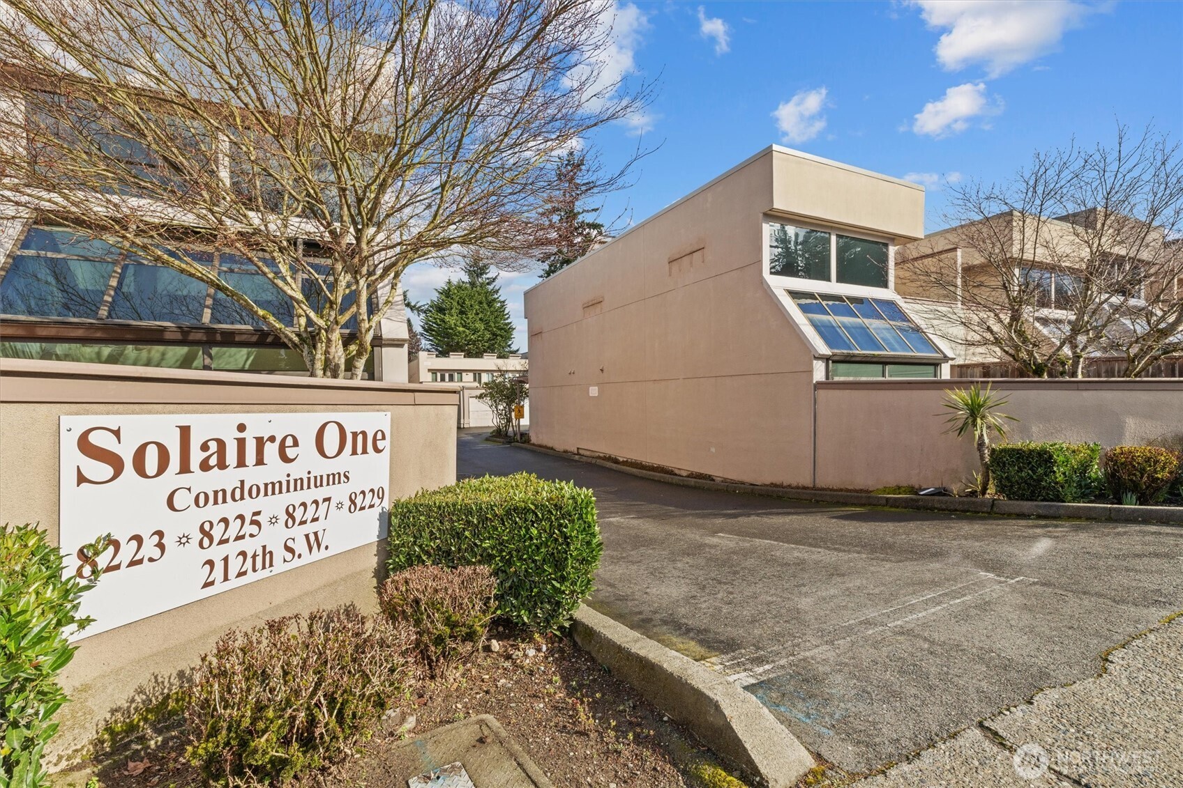 8225 212th Street Southwest, Unit 304 Edmonds, WA 98026 - Photo 33 of 35 a sign on the side of a building