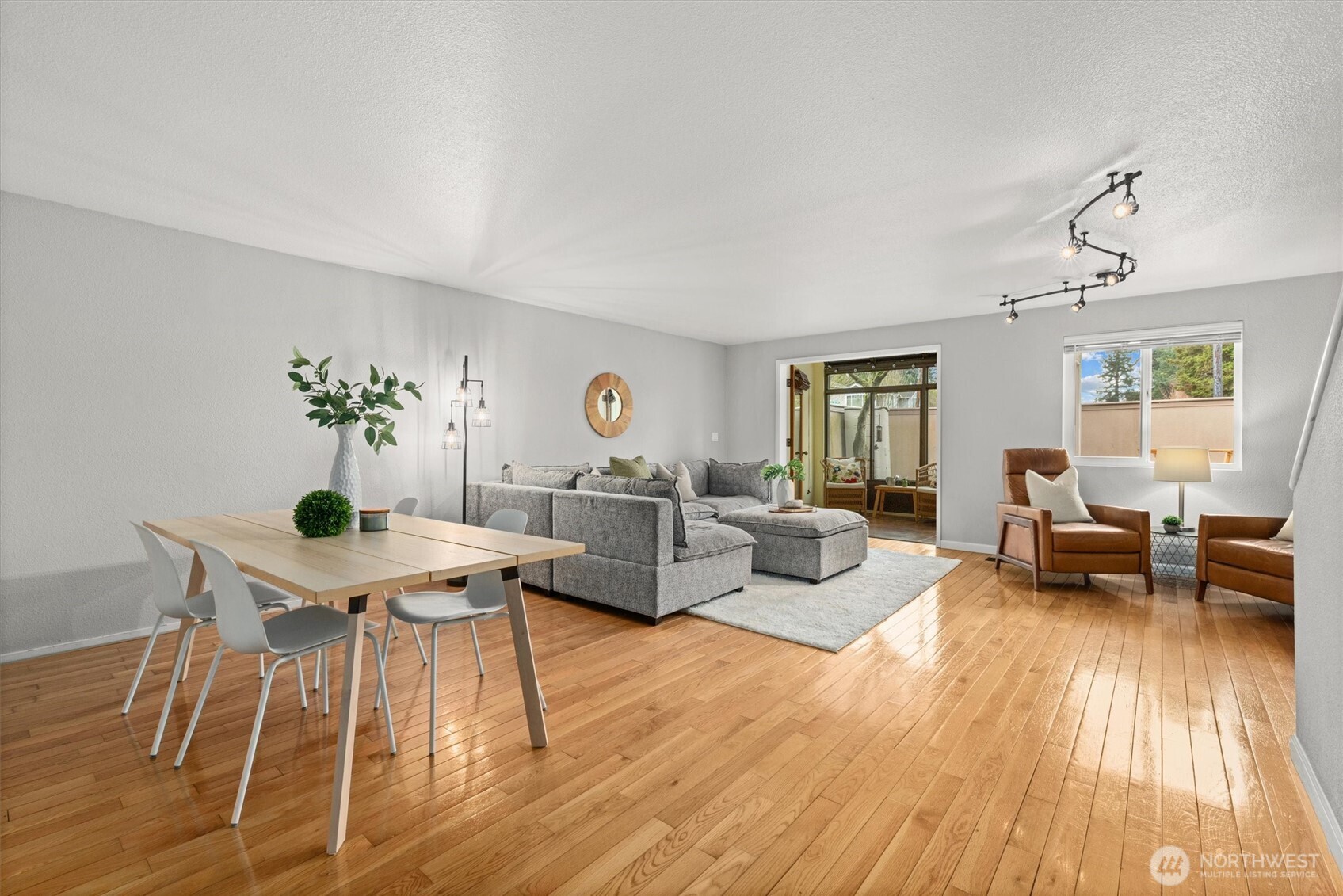 8225 212th Street Southwest, Unit 304 Edmonds, WA 98026 - Photo 8 of 35 a living room with furniture and wooden floor