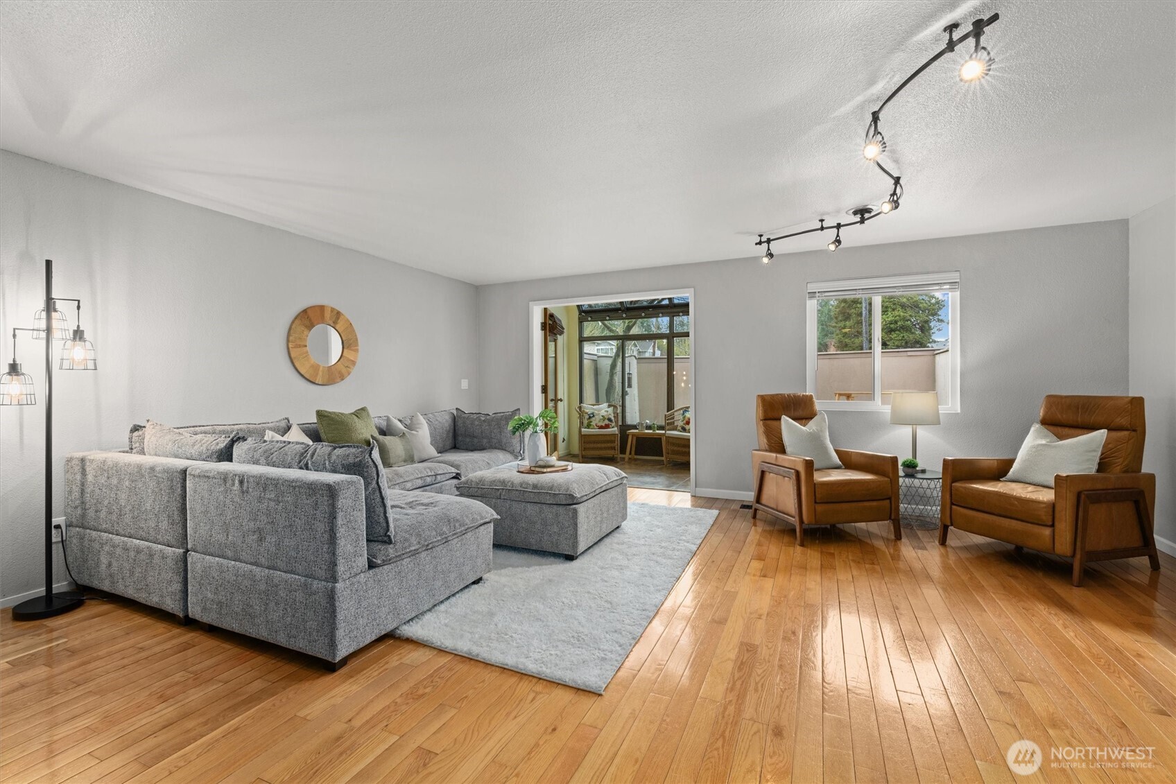 8225 212th Street Southwest, Unit 304 Edmonds, WA 98026 - Photo 10 of 35 a living room with furniture and a large window
