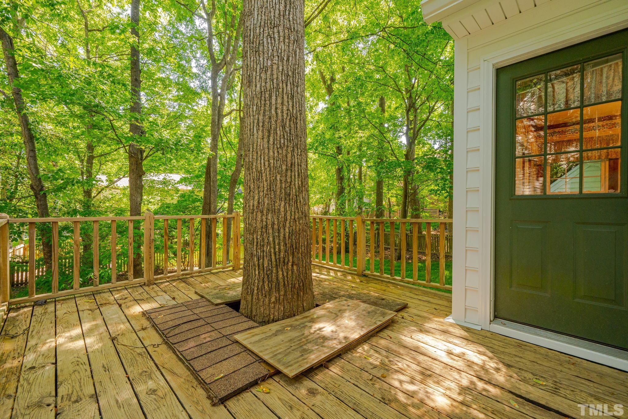 8704 Master Court Raleigh, NC 27615 - Photo 11 of 20 a view of balcony with wooden floor and fence