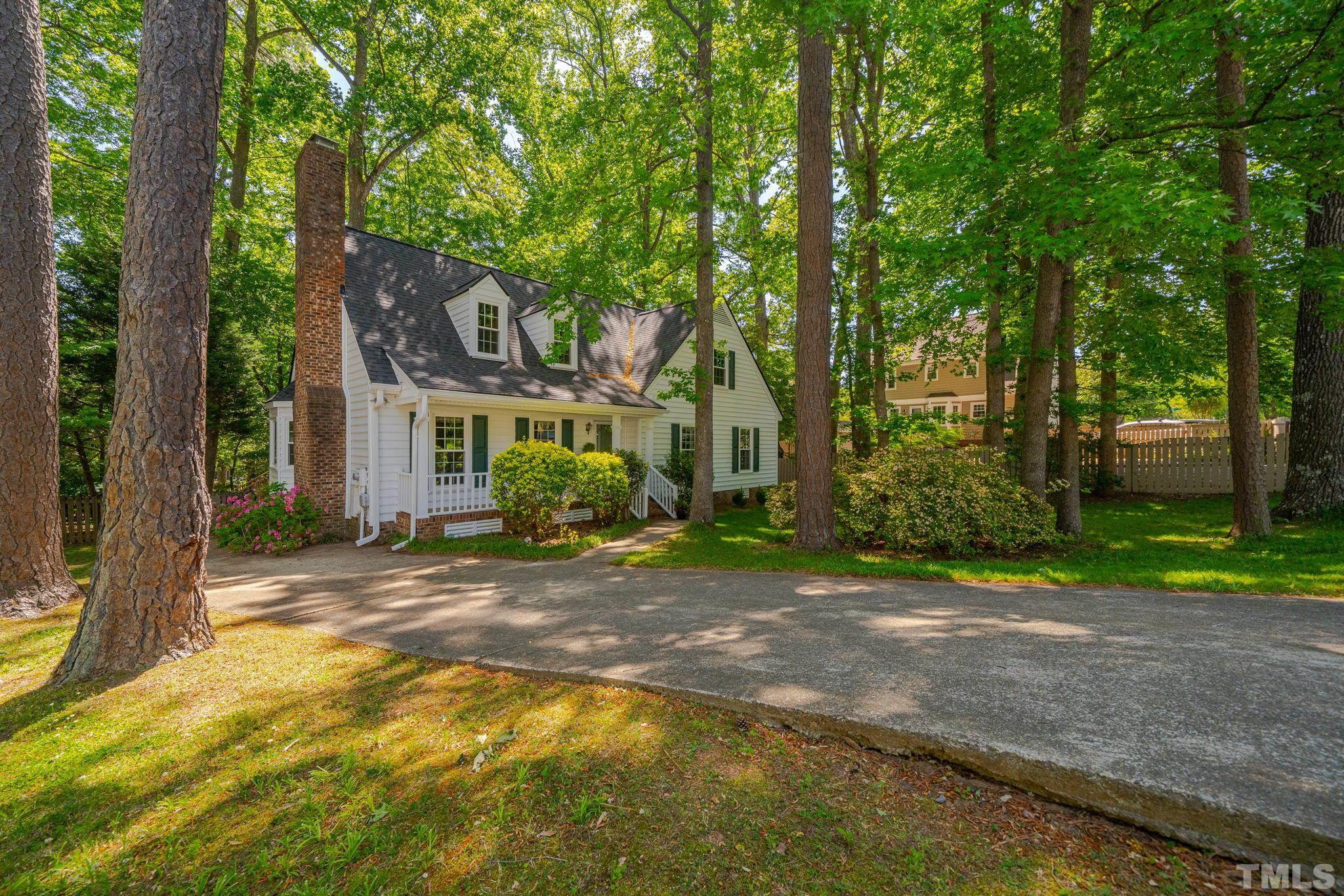 8704 Master Court Raleigh, NC 27615 - Photo 2 of 20 a view of a house with backyard and trees