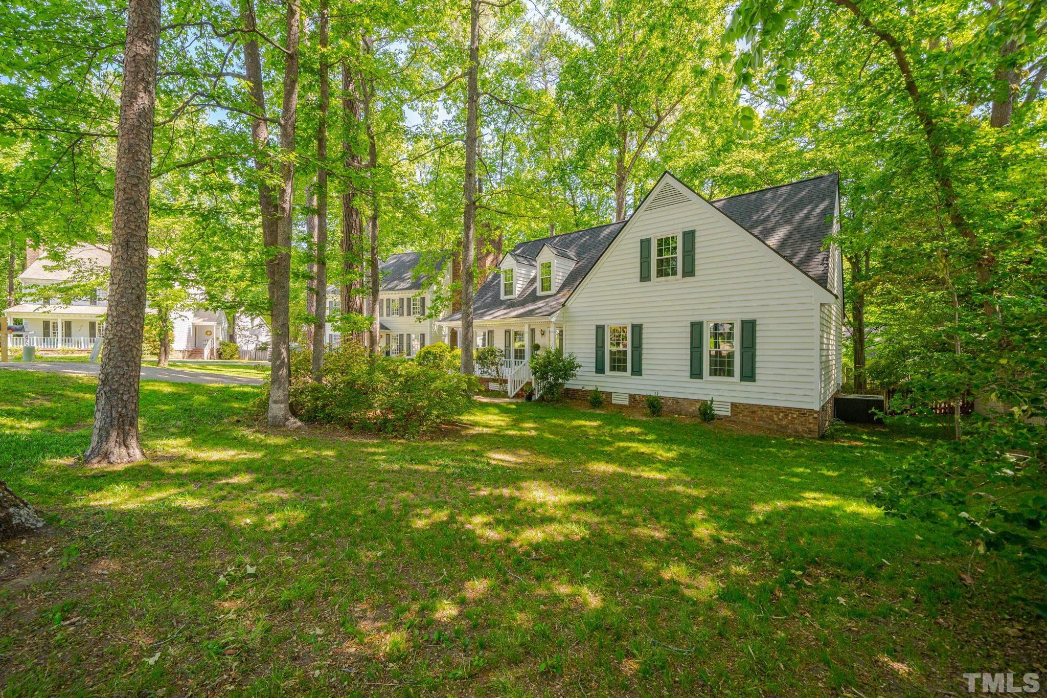8704 Master Court Raleigh, NC 27615 - Photo 5 of 20 a house view with a garden space