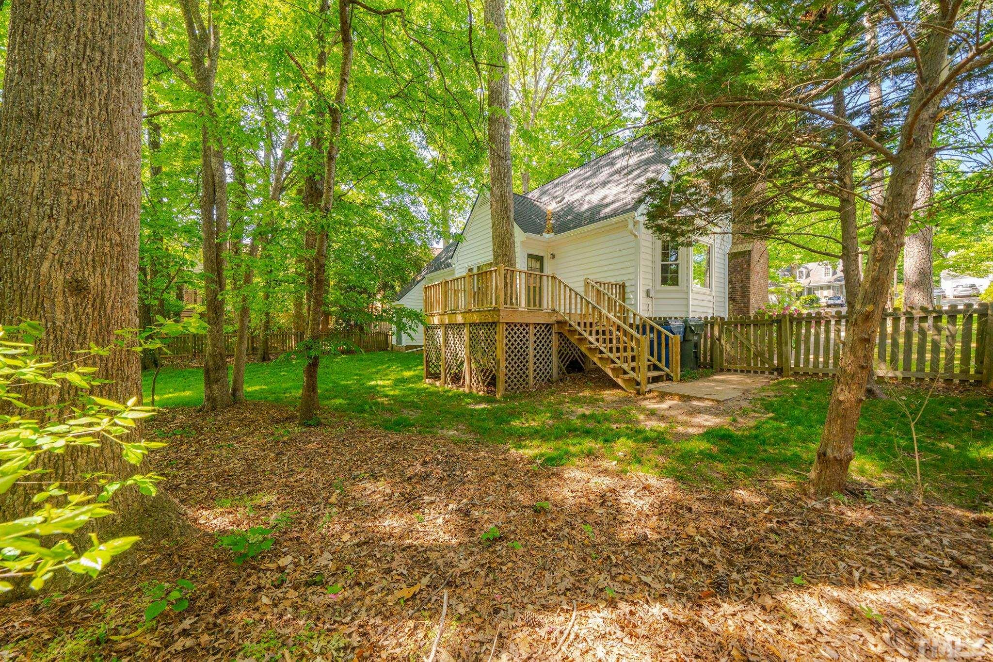 8704 Master Court Raleigh, NC 27615 - Photo 8 of 20 a view of a house with backyard and trees