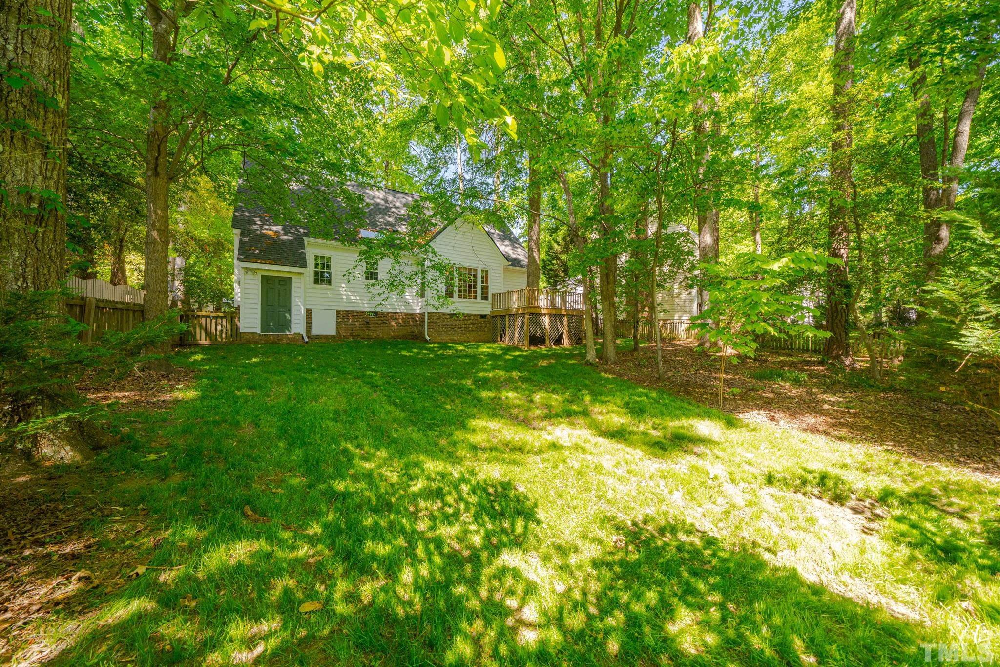 8704 Master Court Raleigh, NC 27615 - Photo 9 of 20 a view of a house with a big yard