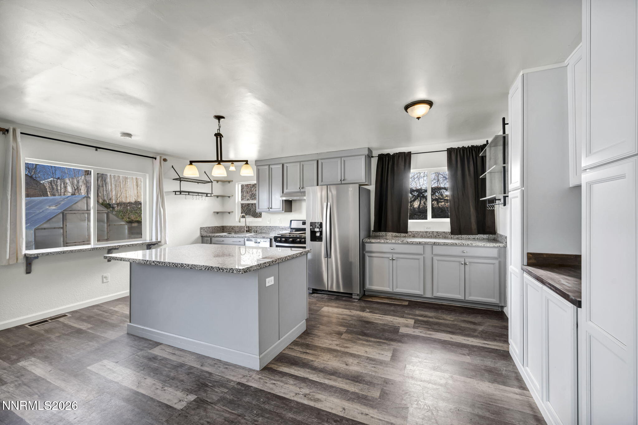 7575 Halifax Drive Reno, NV 89506 - Photo 13 of 58 a kitchen with stainless steel appliances granite countertop a refrigerator and a stove top oven