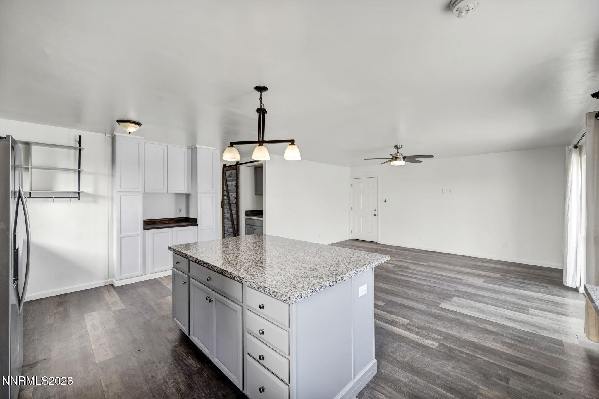 7575 Halifax Drive Reno, NV 89506 - Photo 16 of 58 a kitchen with granite countertop a sink cabinets and stainless steel appliances