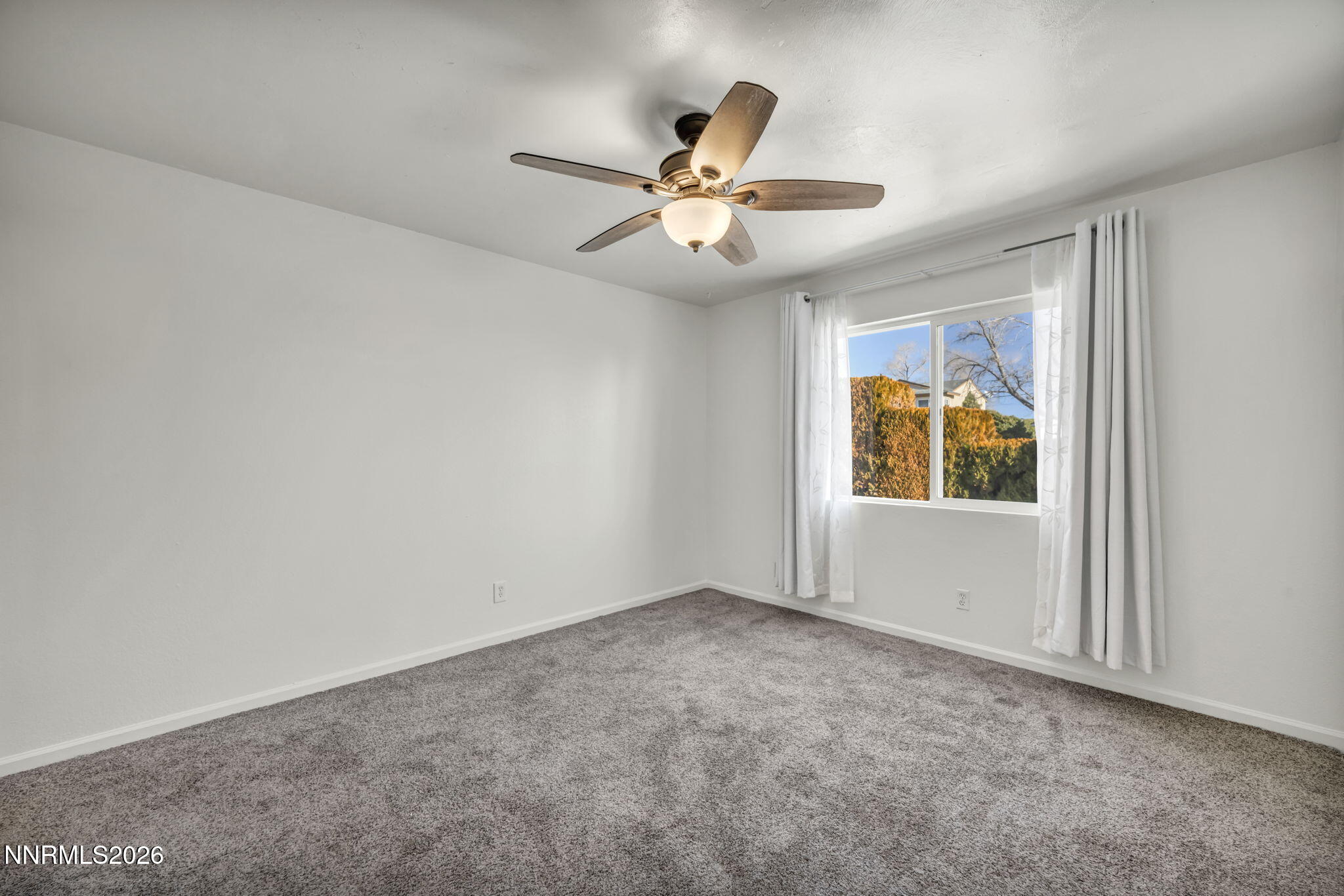 7575 Halifax Drive Reno, NV 89506 - Photo 22 of 58 a view of an empty room with a window