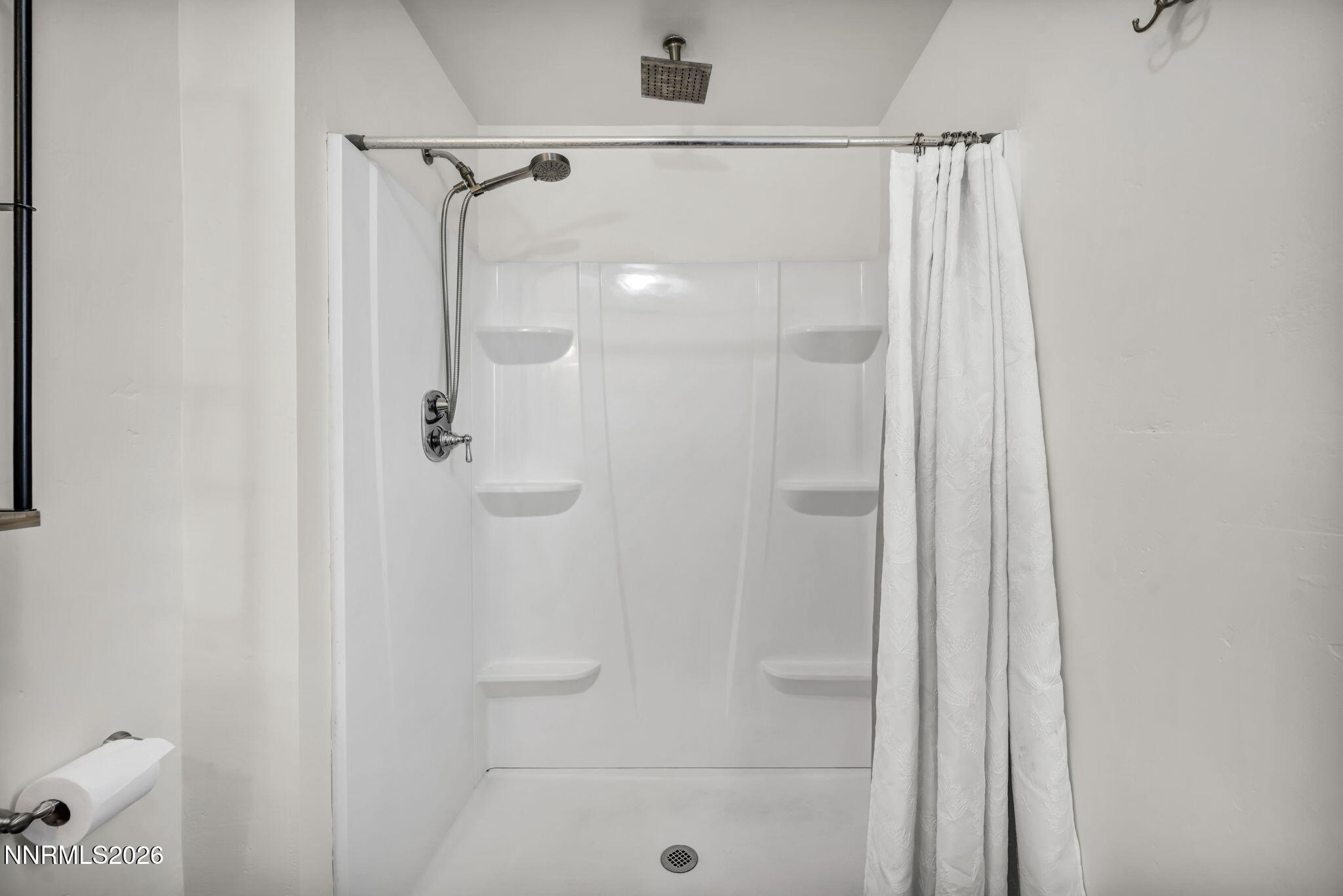 7575 Halifax Drive Reno, NV 89506 - Photo 35 of 58 a bathroom with a glass shower door