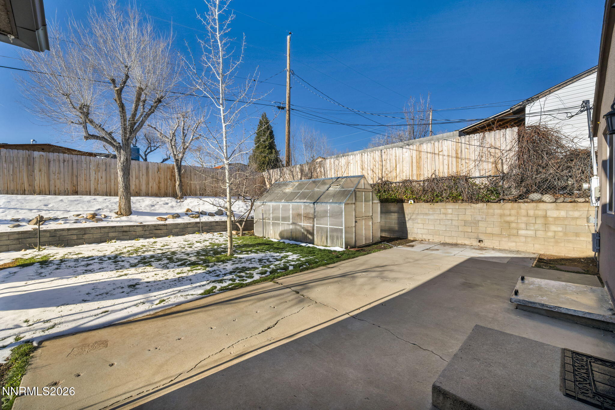 7575 Halifax Drive Reno, NV 89506 - Photo 45 of 58 a view of a road with a bench and trees