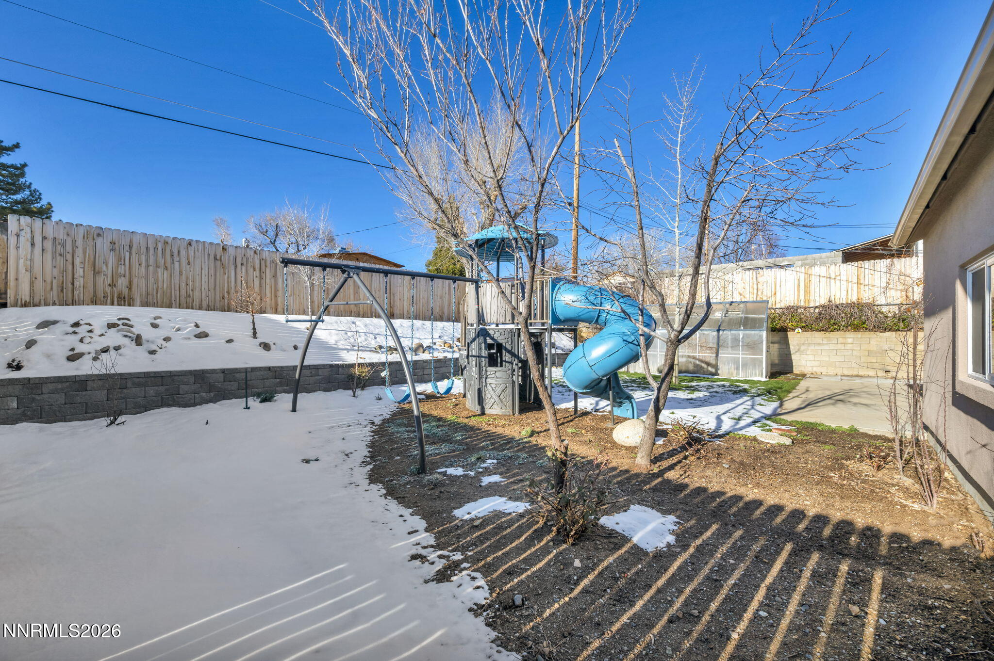7575 Halifax Drive Reno, NV 89506 - Photo 50 of 58 a view of a patio with table and chairs with wooden floor and fence
