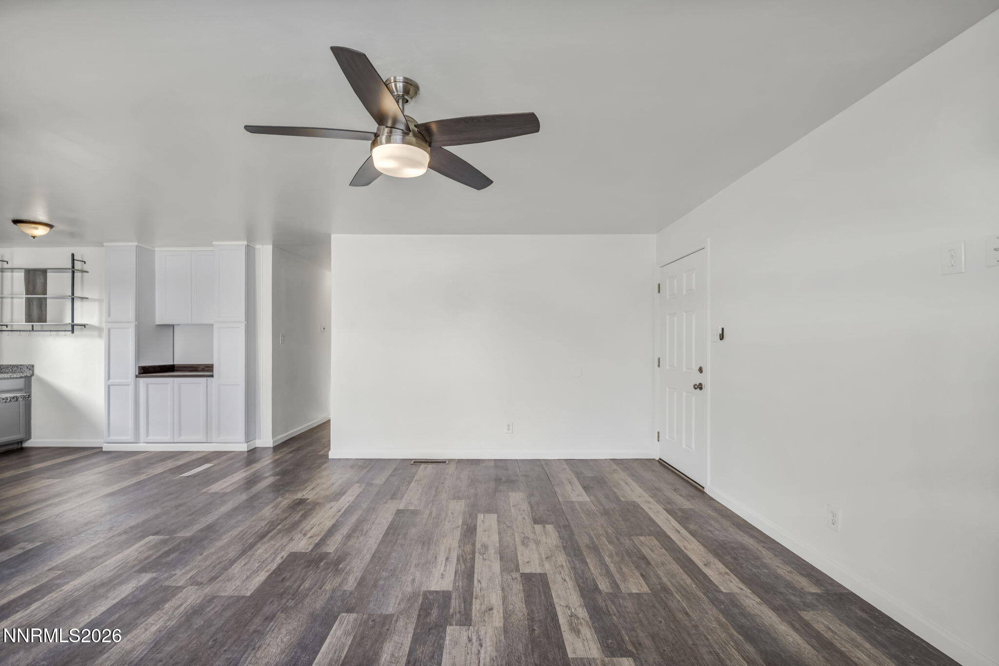 7575 Halifax Drive Reno, NV 89506 - Photo 6 of 58 a view of empty room with wooden floor and window