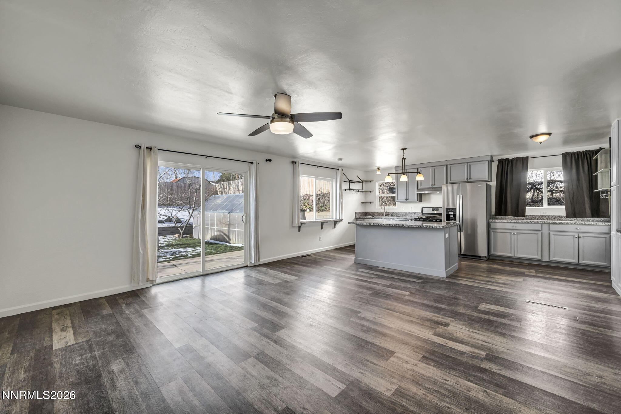 7575 Halifax Drive Reno, NV 89506 - Photo 7 of 58 a view of a kitchen with microwave and refrigerator