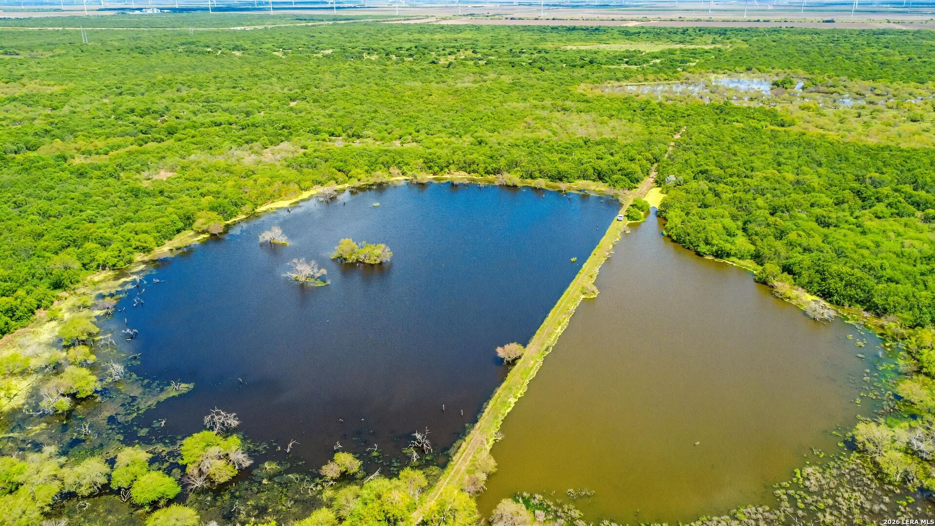 Tbd Zinnia Road Lyford, TX 78580 - Photo 2 of 10 a view of a lake from a yard
