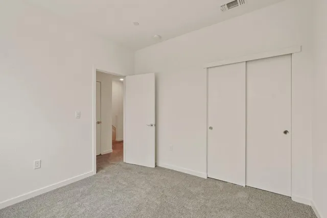 a bathroom with a sink a mirror a vanity and a shower