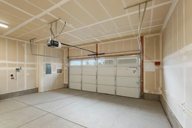 a view of a patio with a table and chairs and potted plants