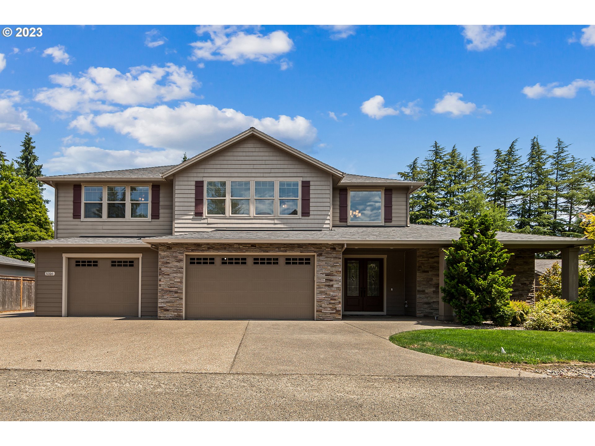 5316 Southwest Childs Road Lake Oswego, OR 97035 - Photo 1 of 42 a front view of a house with a garden