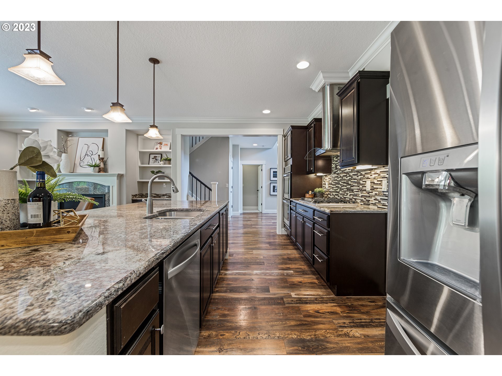 5316 Southwest Childs Road Lake Oswego, OR 97035 - Photo 13 of 42 a kitchen with stainless steel appliances granite countertop a sink a counter top space cabinets and wooden floor
