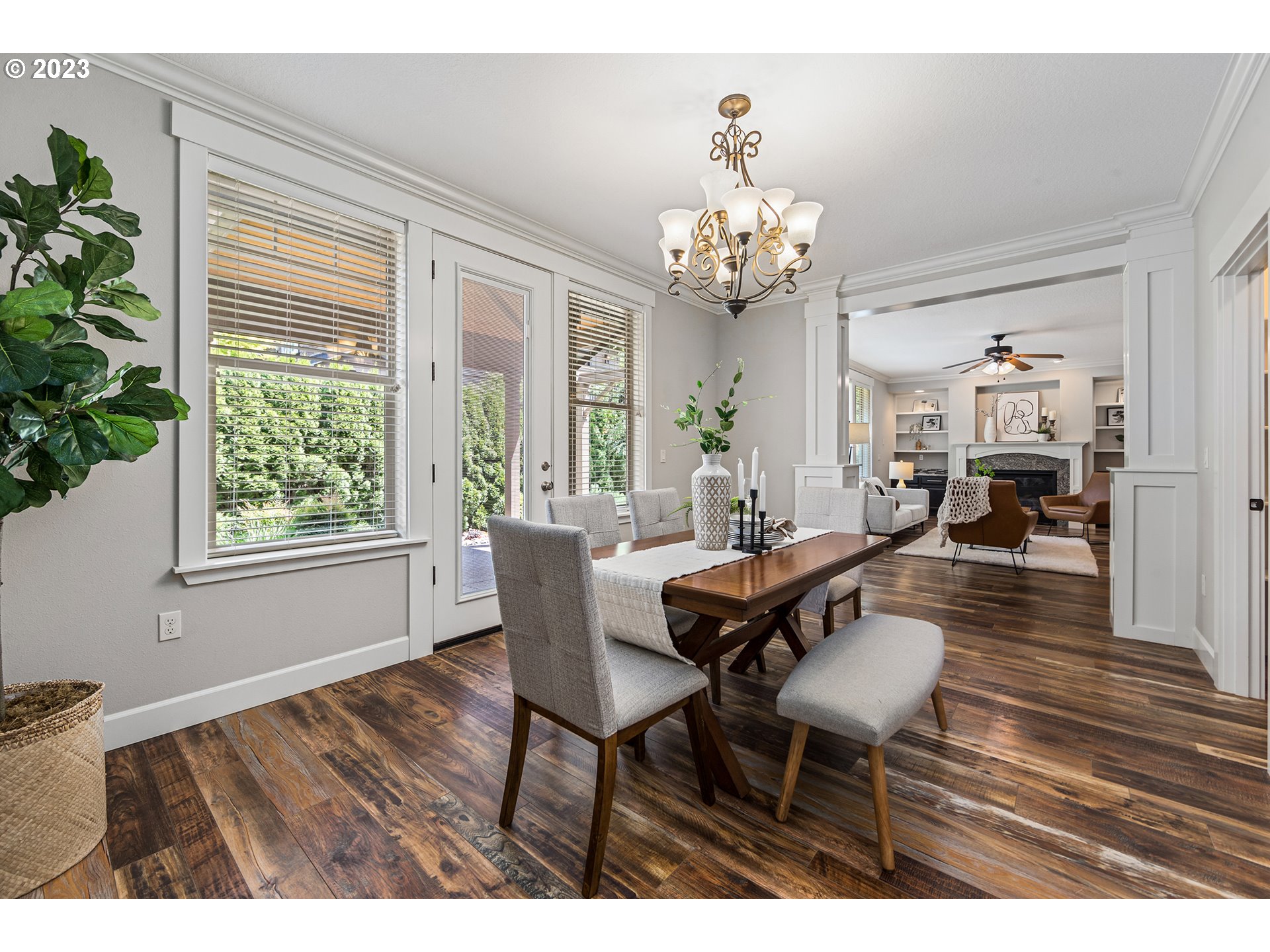 5316 Southwest Childs Road Lake Oswego, OR 97035 - Photo 17 of 42 a view of a dining room with furniture a chandelier and wooden floor