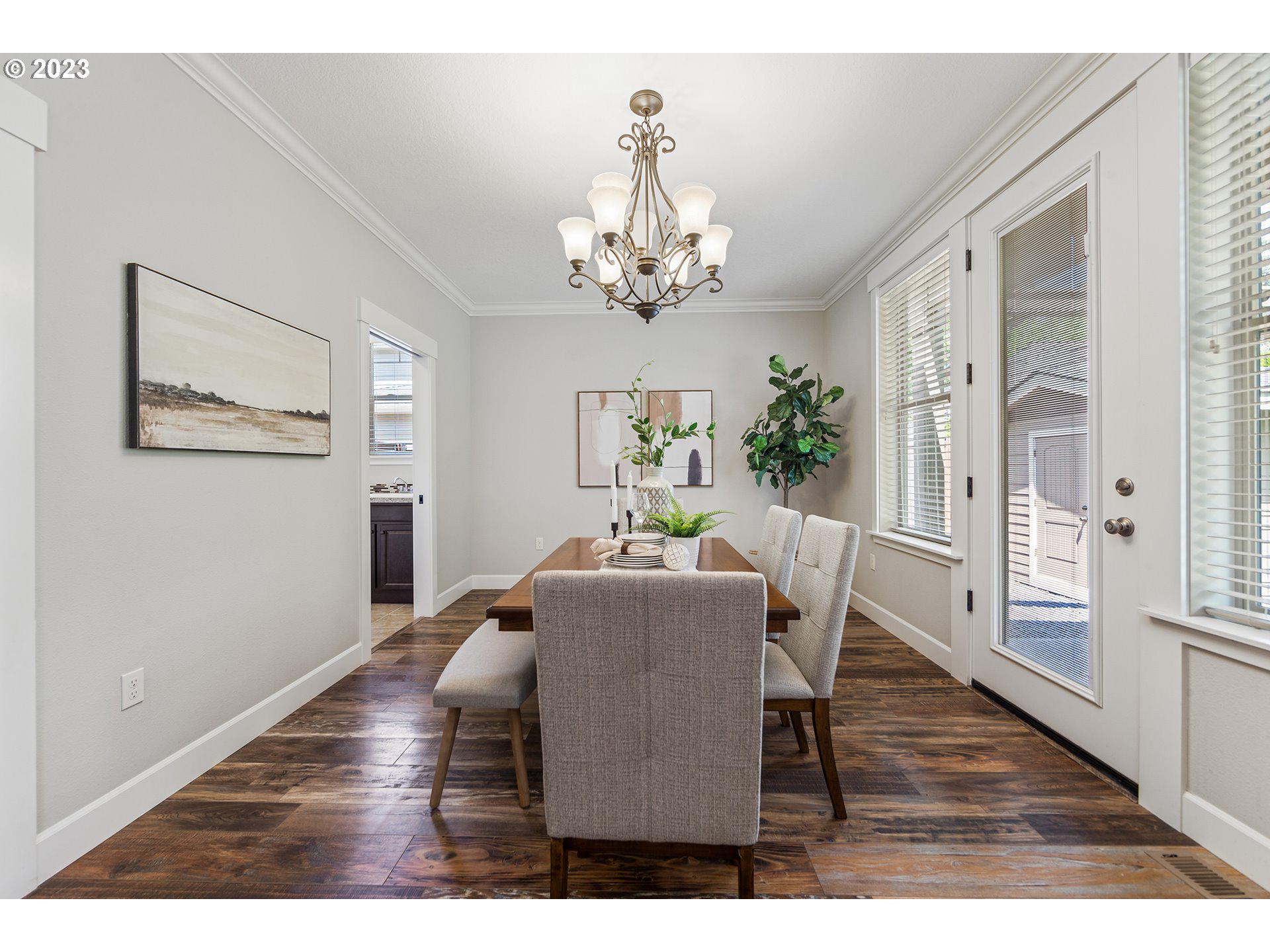 5316 Southwest Childs Road Lake Oswego, OR 97035 - Photo 18 of 42 a view of a dining room with furniture a chandelier and wooden floor